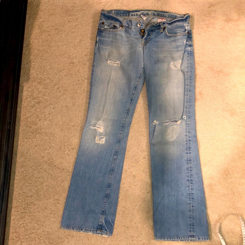 Lucky light blue boot cut jeans; distressed denim